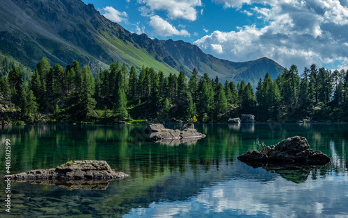 Lake Saoseo in Grisons, Switzerland: Beautiful reflections of mountains and sky © Thomas