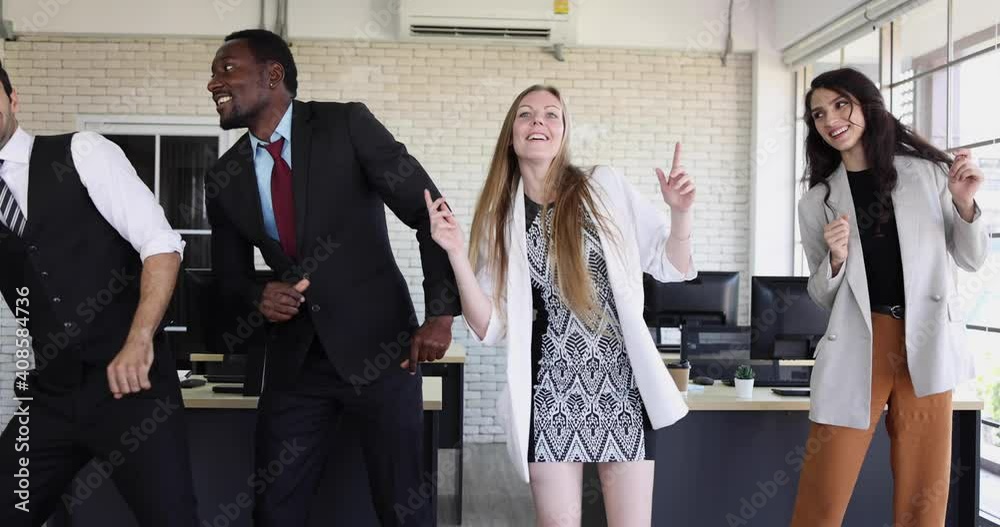 Diverse business team people dancing celebrating success in office ...