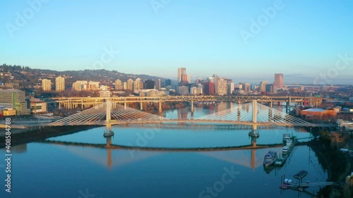 Street Car Passing over the Tilikum Crossing Bridge on the Willamette River in Downtown Portland Oregon photo