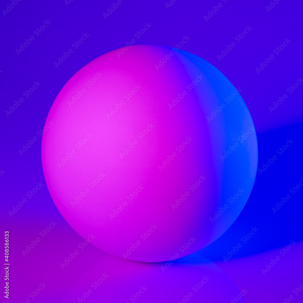 Gypsum sphere in pink and blue neon light