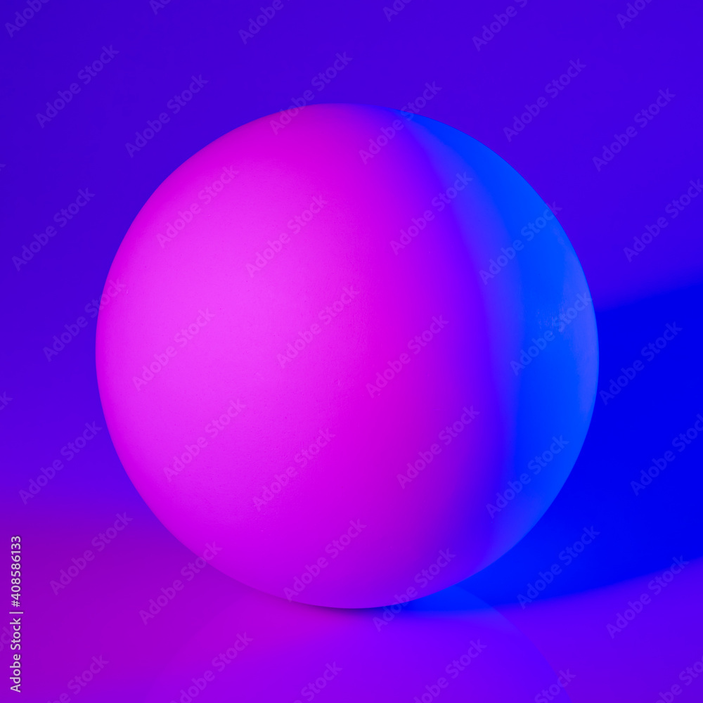 Gypsum sphere in pink and blue neon light Gypsum sphere in pink and blue neon light