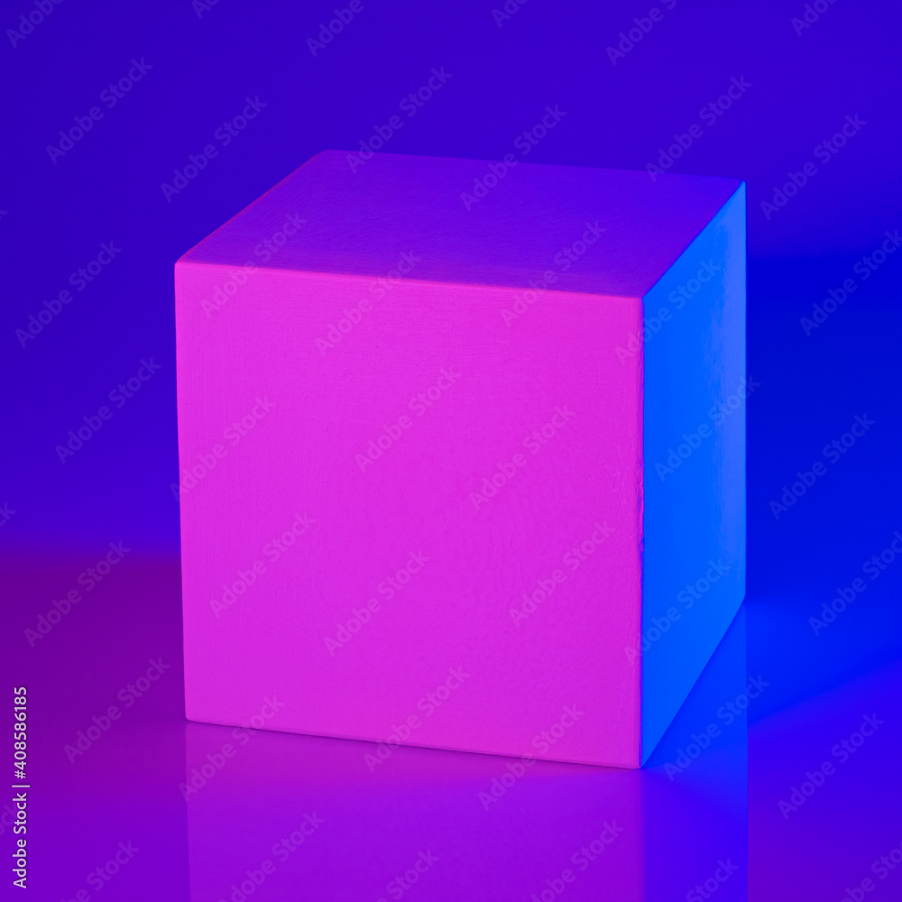 Gypsum cube in pink and blue neon light Gypsum cube in pink and blue neon light