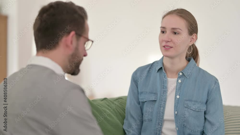 Woman Arguing with Man While Sitting on Sofa, Fighting Woman Arguing with Man While Sitting on Sofa, Fighting