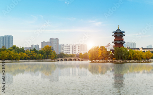 In autumn, ancient buildings and arch bridges are in Yingze Park, Taiyuan, Shanxi Province, China photo