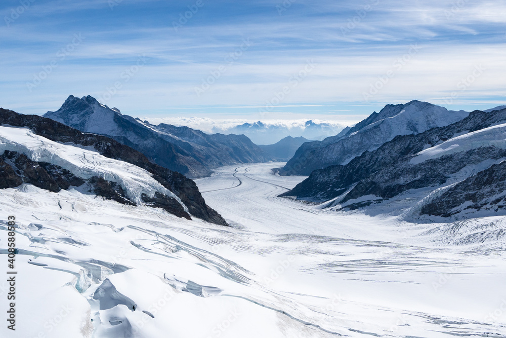 Amazing view of Aletsch Glacier, the largest glacier in the Alps, world heritage of Swiss and Bernese alps alpine snow mountains peaks, beautiful landscapes view downhill from the top of Jungfraujoch