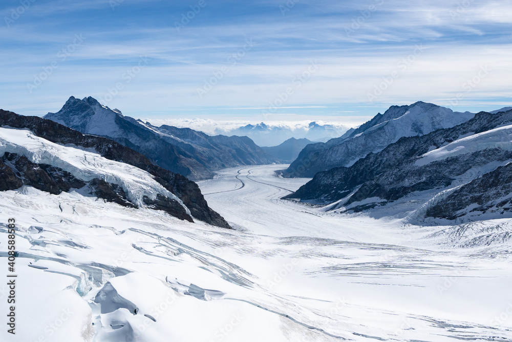 Amazing view of Aletsch Glacier, the largest glacier in the Alps, world heritage of Swiss and Bernese alps alpine snow mountains peaks, beautiful landscapes view downhill from the top of Jungfraujoch Amazing view of Aletsch Glacier, the largest glacier in the Alps, world heritage of Swiss and Bernese alps alpine snow mountains peaks, beautiful landscapes view downhill from the top of Jungfraujoch