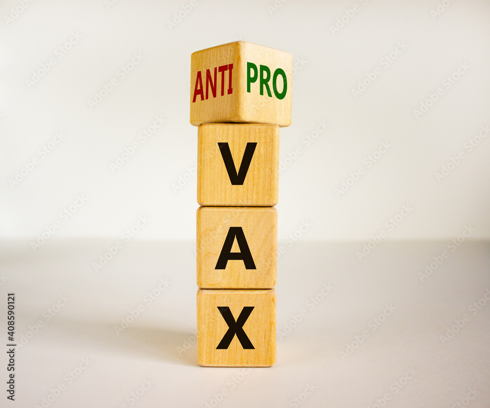 Pro-vax or anti-vax symbol. Turned a cube, changed words 'anti-vax' to 'pro-vax'. Beautiful white background. Copy space. Business, medical covid-19 pro-vax or anti-vax concept. Pro-vax or anti-vax symbol. Turned a cube, changed words 'anti-vax' to 'pro-vax'. Beautiful white background. Copy space. Business, medical covid-19 pro-vax or anti-vax concept.