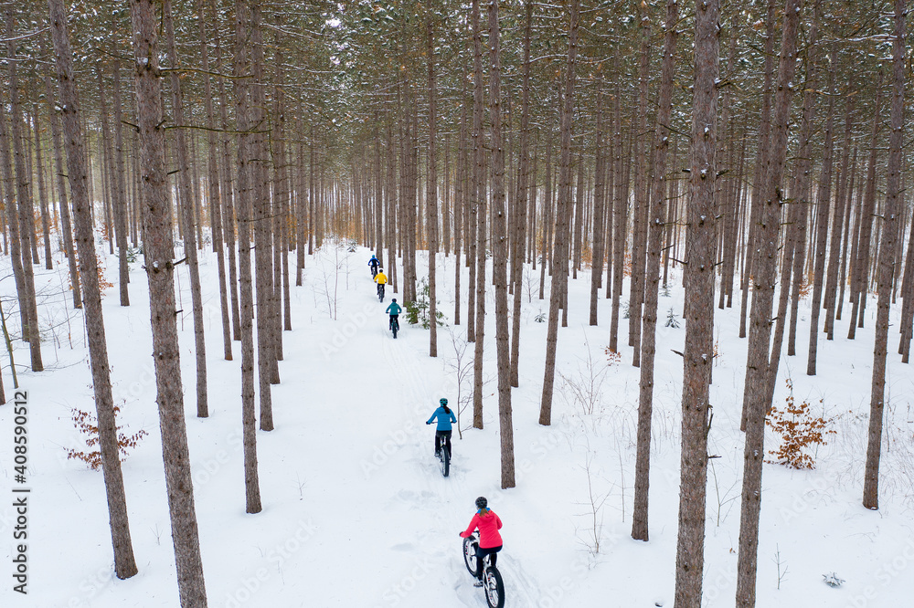Aerial photo of a group riding fat bikes in the snow