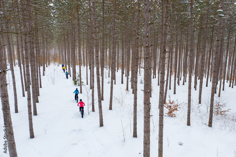 Aerial photo of a group riding fat bikes in the snow