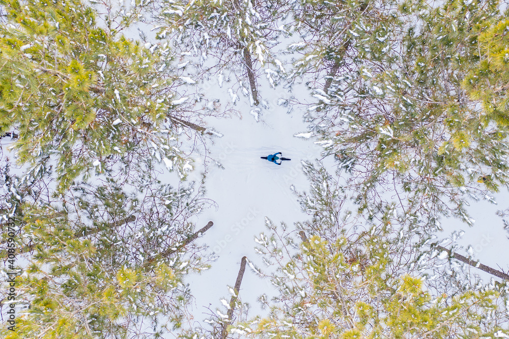 Aerial photo of a couple riding fat bikes in the snow