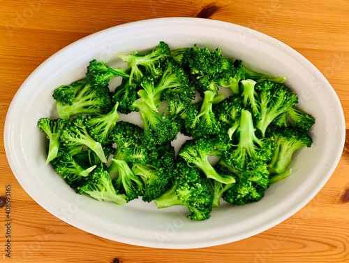 Photos Step-by-step preparation of broccoli with cheese on a wooden table preparation o