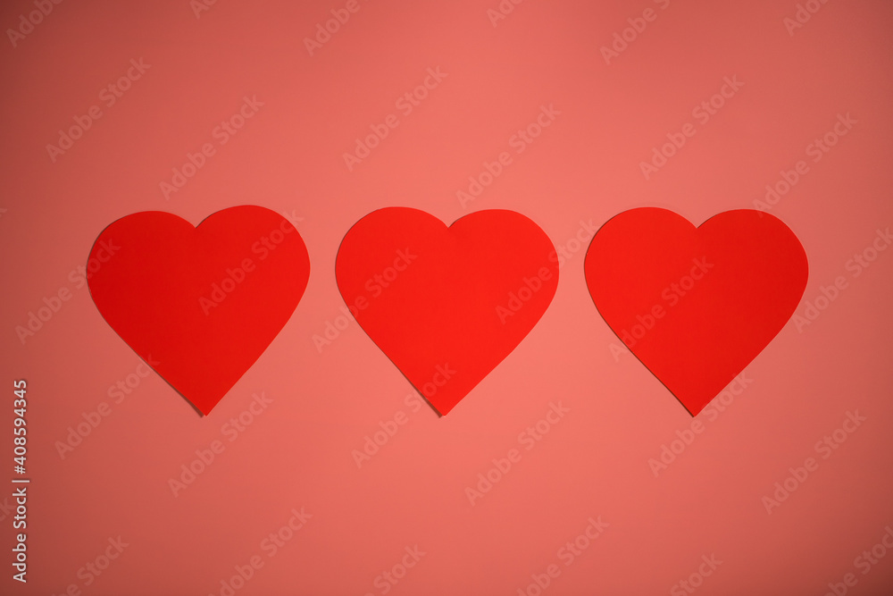 Three Red Heart Shapes On Background.