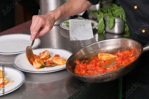 chef preparing a dish of italian typical pasta