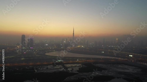 Wide Aerial Drone shot of Dubai skyline at sunset 8km distance photo