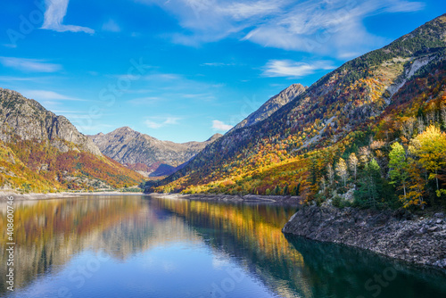 Baserca reservoir during Autumn under bright blue sky, Spain photo