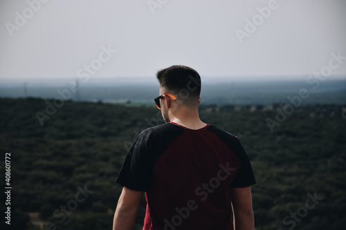 Fototapeta Naklejka Na Ścianę i Meble -  Man on the top of the mountain looking the horizon