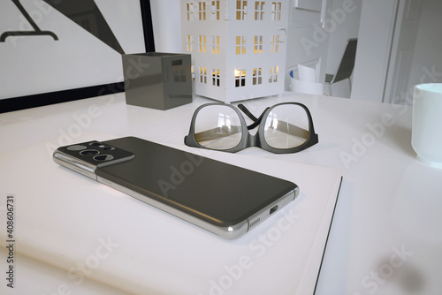 Close-up of a smartphone placed in the workplace.