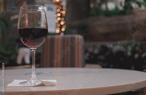 glass of red wine on a table Red wine is a type of wine made from dark-colored grape varieties. color of the wine can range from violet, or brick red for mature wines and brown for older red wines.