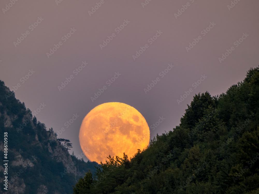 Obraz premium moon over the mountains