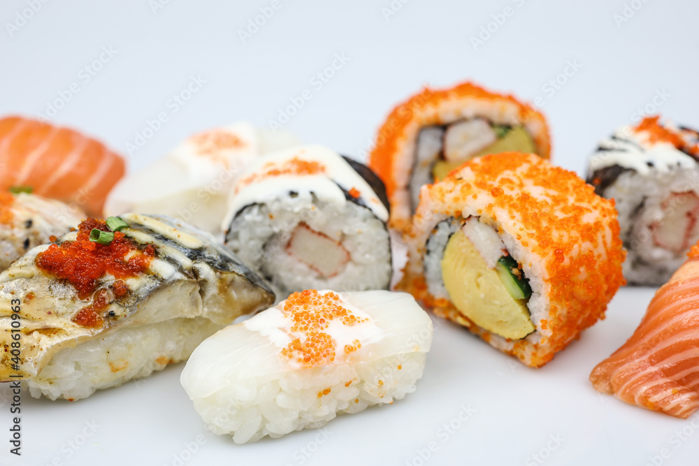 Sushi rolls japanese food isolated on white background. California Sushi roll with tuna, vegetables and unagi sauce closeup. Japan restaurant menu.
Sushi rolls japanese food isolated on white background. California Sushi roll with tuna, vegetables and unagi sauce closeup. Japan restaurant menu.