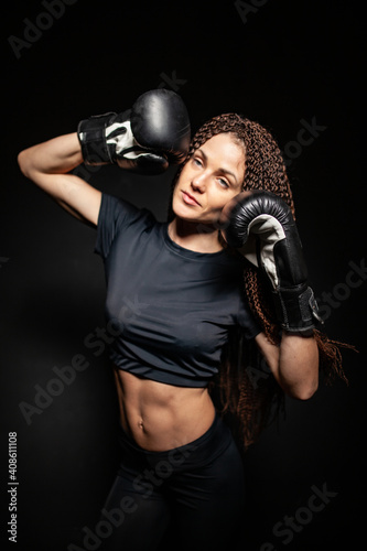 girl boxer, boxing gloves on sports girl, womens boxing, athletic body © Egor  Terentev
