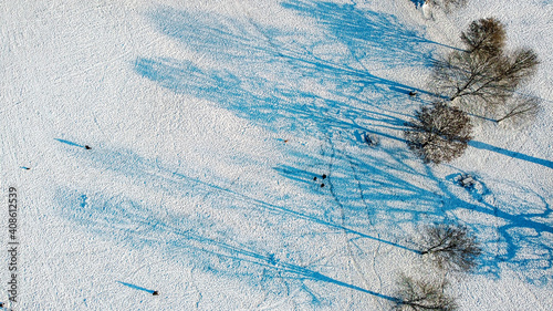 Snow covered public park birds eye view, aerial drone