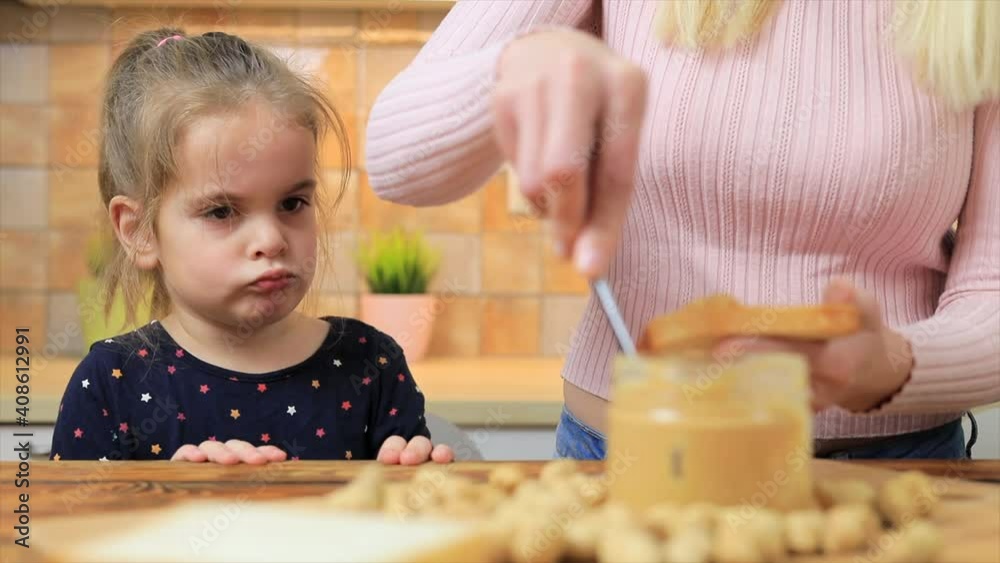 Little girl don't want eating sandwich with peanut butter Little girl don't want eating sandwich with peanut butter