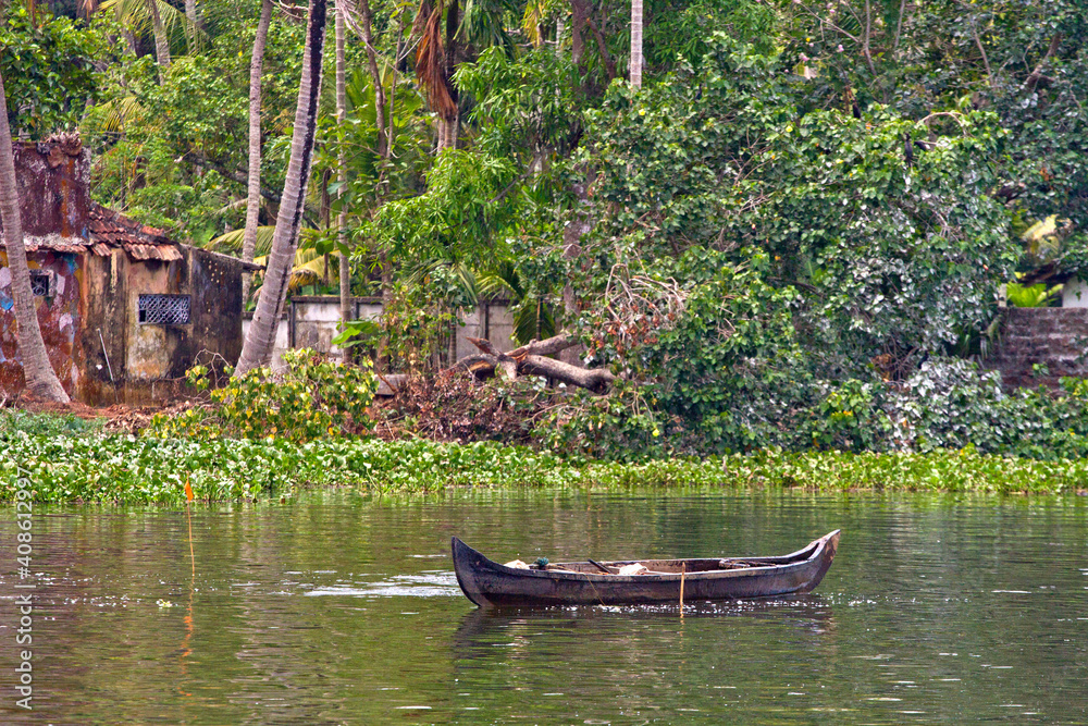 Houseboats on the backwaters of Kerala in Alappuzha (Alleppey) in India. A traditional tourist attraction is the house-boat on the river channels of Kerala. Houseboats on the backwaters of Kerala in Alappuzha (Alleppey) in India. A traditional tourist attraction is the house-boat on the river channels of Kerala.