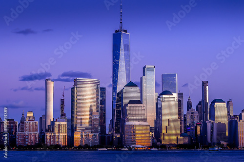 Amazing view of Manhattan skyline.  New York City  cityscape.  Modern buildings, Hudson river, sunset light.  View from New Jersey.