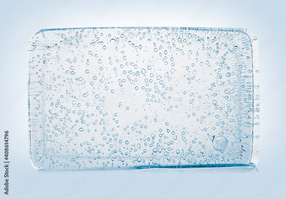 The rectangular block of pure transparent ice with air bubbles in cold blue tones on a white background. The rectangular block of pure transparent ice with air bubbles in cold blue tones on a white background.