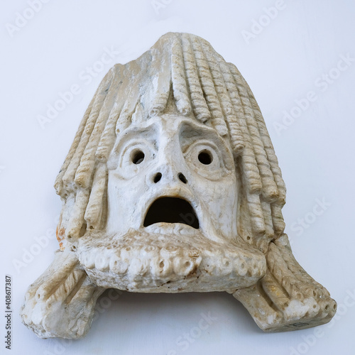 Ancient Greek theater tragedy mask on a white backround