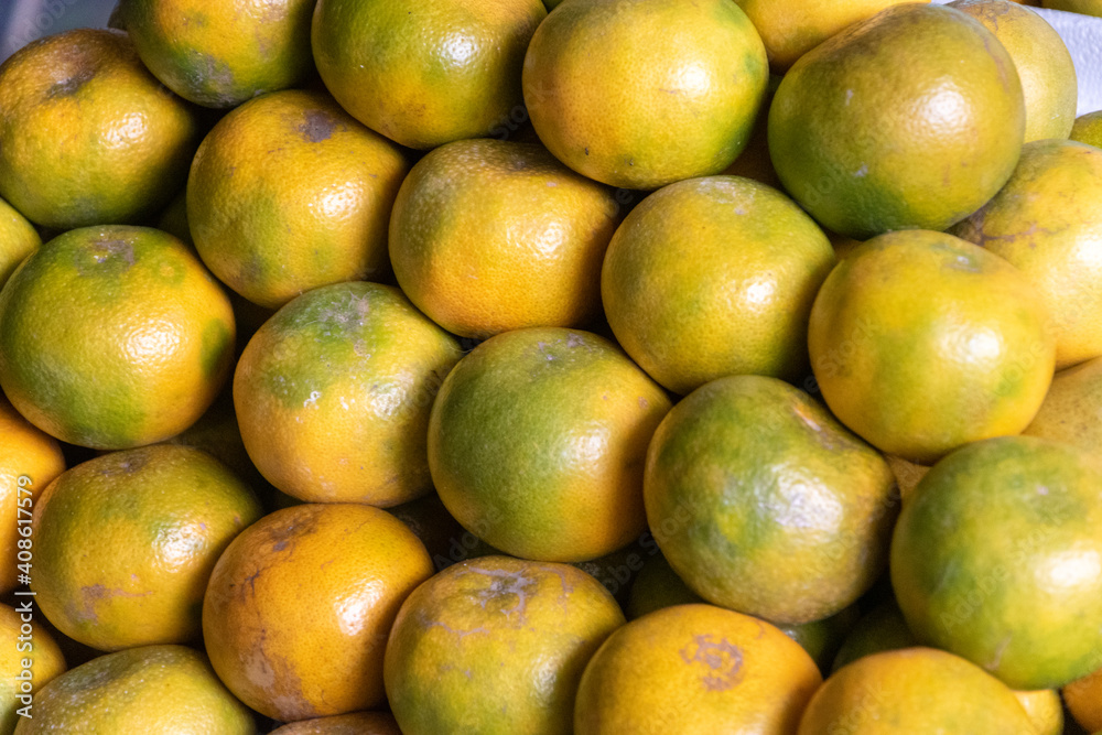 Fresh tangerines on traditional market as background Fresh tangerines on traditional market as background