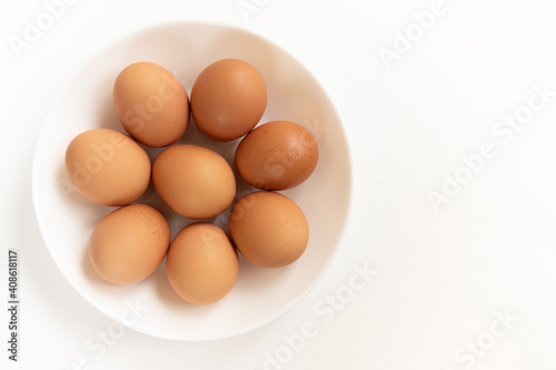 Group brown fresh eggs, isolated on white background.