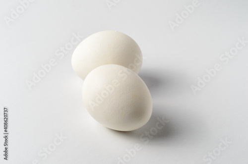 Still life with two chicken eggs on a white background