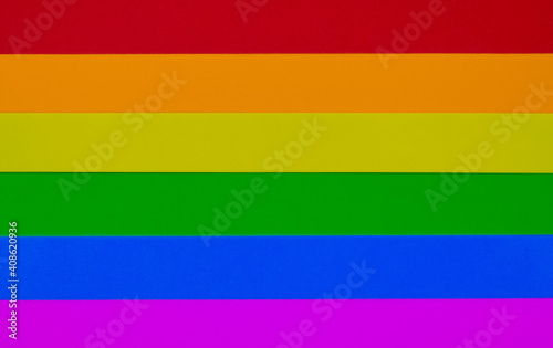 lgbt flag made with colored cardboard in the order of red, orange, yellow, green, blue, purple with space for text
