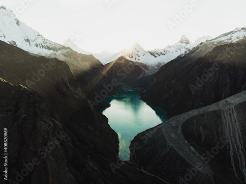 Aerial panorama of blue turquoise alpine mountain lake Laguna Paron in Caraz Huaraz Ancash Cordillera Blanca Peru photo