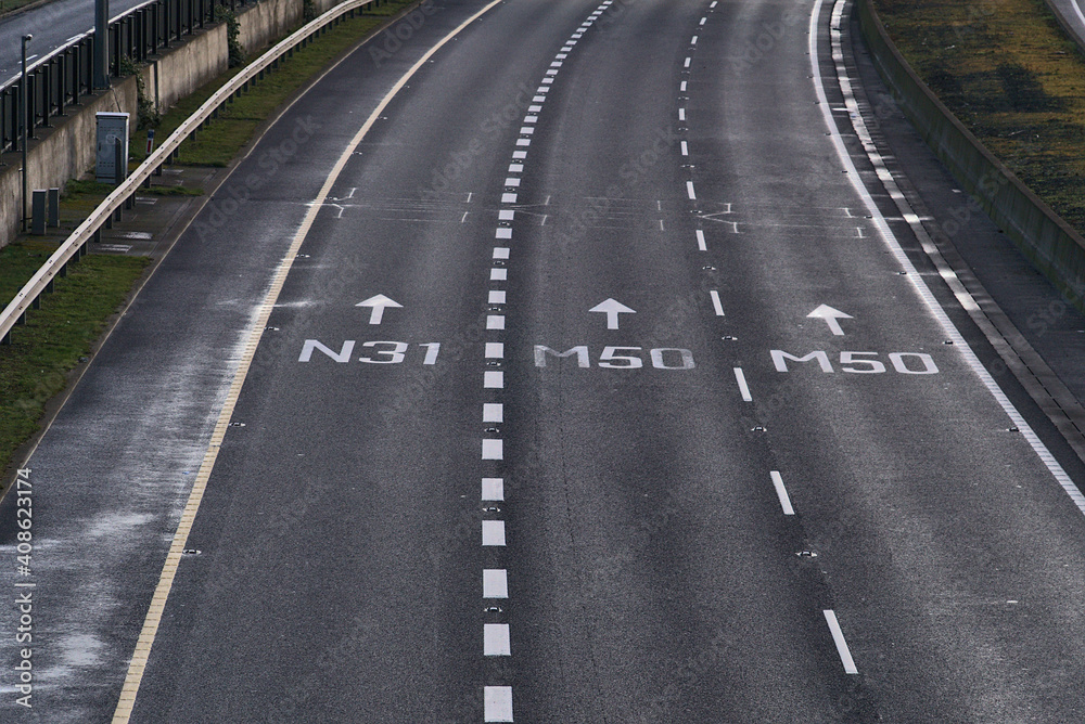 Close up aerial view of N31 M50 road signs on M50 road in Dublin, Ireland. Empty motorway during Level 5 COVID restrictions