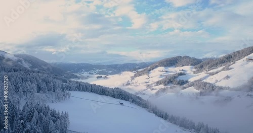Wallpaper Mural Mountain slopes in snow and golden sunlight, quiet winter solitude, aerial view Torontodigital.ca