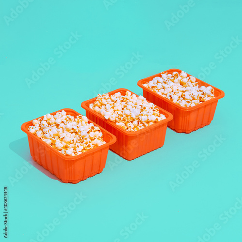 Minimal popcorn set plastic box. Isometry trendy design. Home cinema concept photo