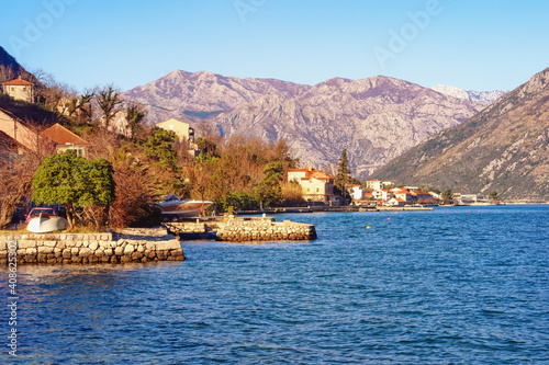 Beautiful winter Mediterranean landscape. Montenegro, Adriatic Sea, View of Bay of Kotor and Prcanj town © Olga Iljinich