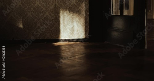 ray of light falls on door closing with creeksqueak in old soviet flat room with old wallpapers Chornobyl 4k slow motion