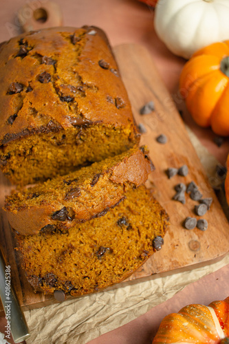 sliced pumpkin chocolate chip bread on wooden board