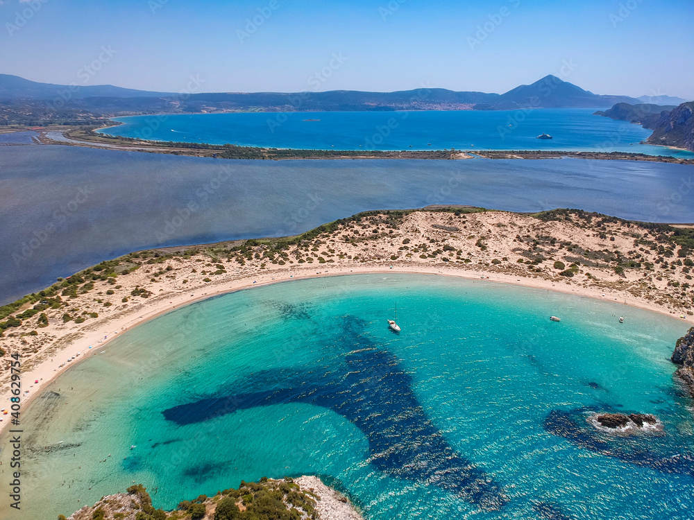 Aerial panorama view of the famous semicircular sandy beach and lagoon of Voidokilia in Messenia, Greece
