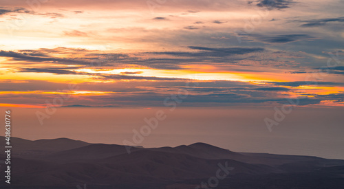 Incredible sunset from the mountain with views and red color © Nelson