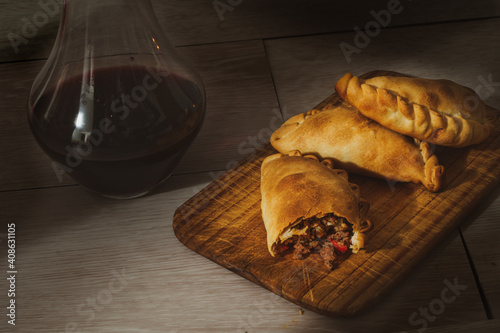 Argentinian delicious empanadas and wine photo