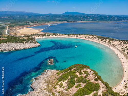 Aerial panorama view of the famous semicircular sandy beach and lagoon of Voidokilia in Messenia, Greece