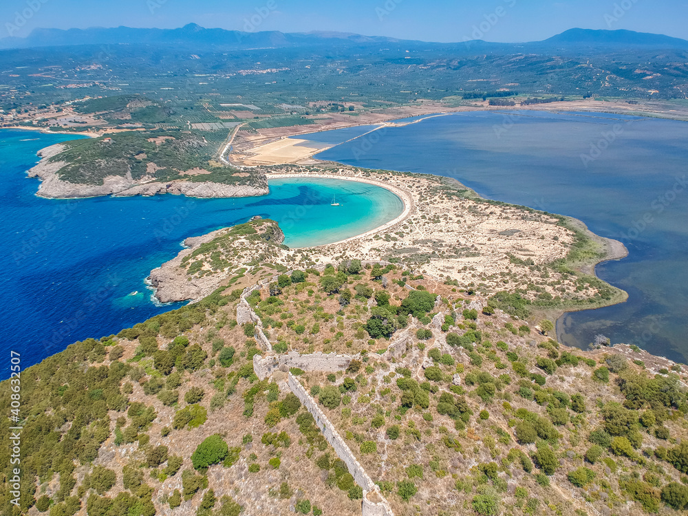 Aerial panorama view of the famous semicircular sandy beach and lagoon of Voidokilia in Messenia, Greece