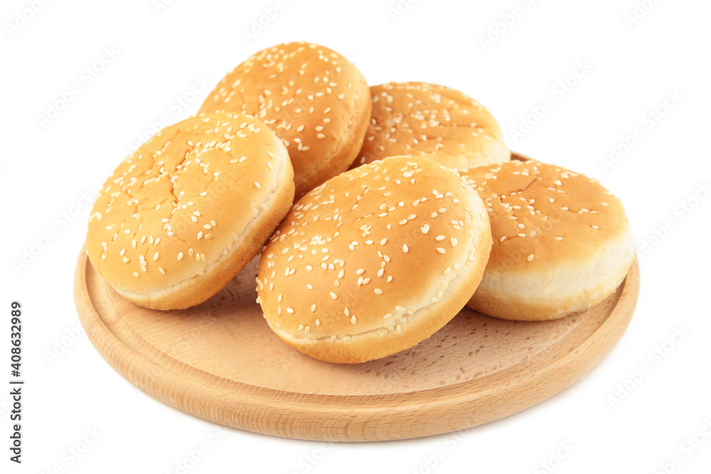 Burger buns on cutting board isolated on a white background.