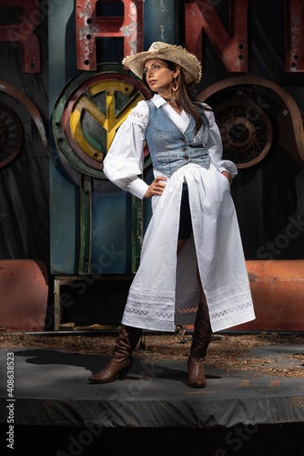 Beautiful Asian Indian woman in cowgirl themed fashion shoot.