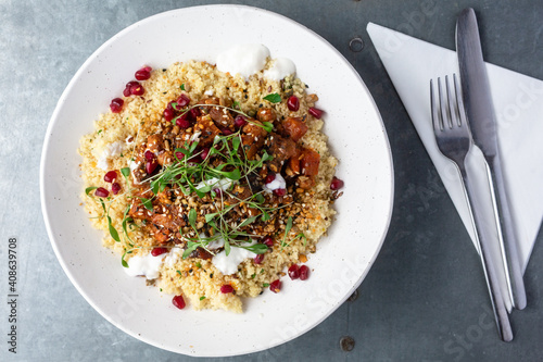 Fotografie Moroccan tagine with aubergine and citrus couscous